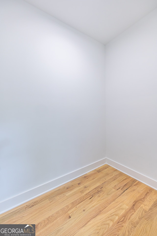 spare room with light hardwood / wood-style floors