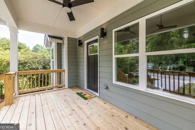 wooden terrace featuring ceiling fan