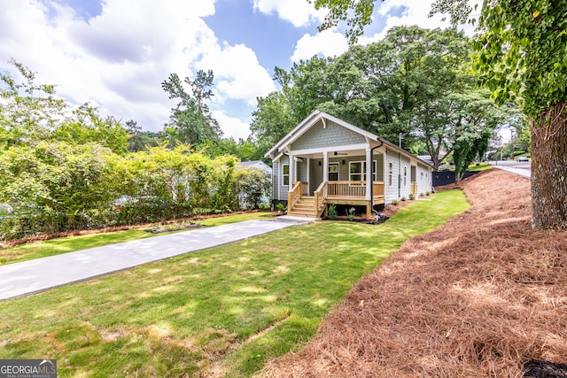 view of front of property with a porch and a front lawn