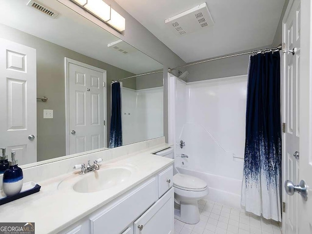 full bathroom featuring tile floors, vanity with extensive cabinet space, shower / tub combo with curtain, and toilet