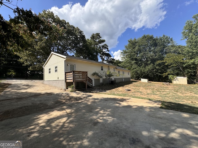 view of front of house with a wooden deck