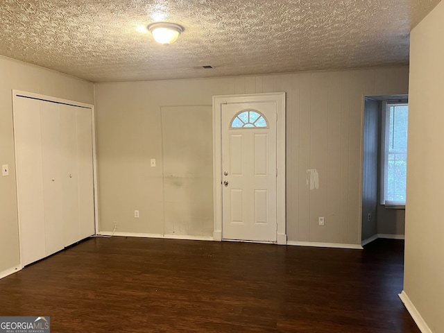 spare room with wood-type flooring and a textured ceiling