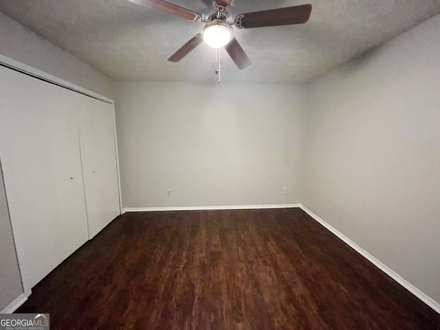 spare room featuring a textured ceiling and hardwood / wood-style flooring