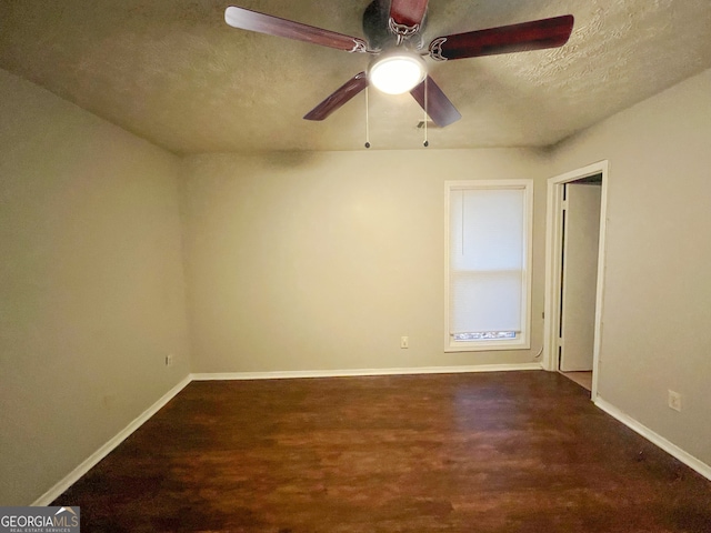 unfurnished bedroom featuring dark hardwood / wood-style flooring, a textured ceiling, and a closet