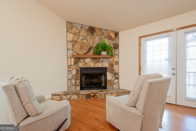 living room featuring hardwood / wood-style flooring and a fireplace