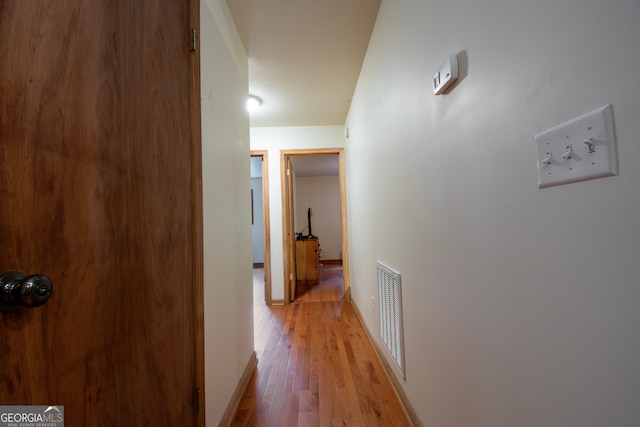 hall featuring wood-type flooring