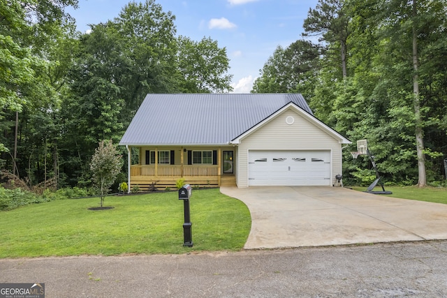 view of front of property with covered porch, a garage, and a front lawn