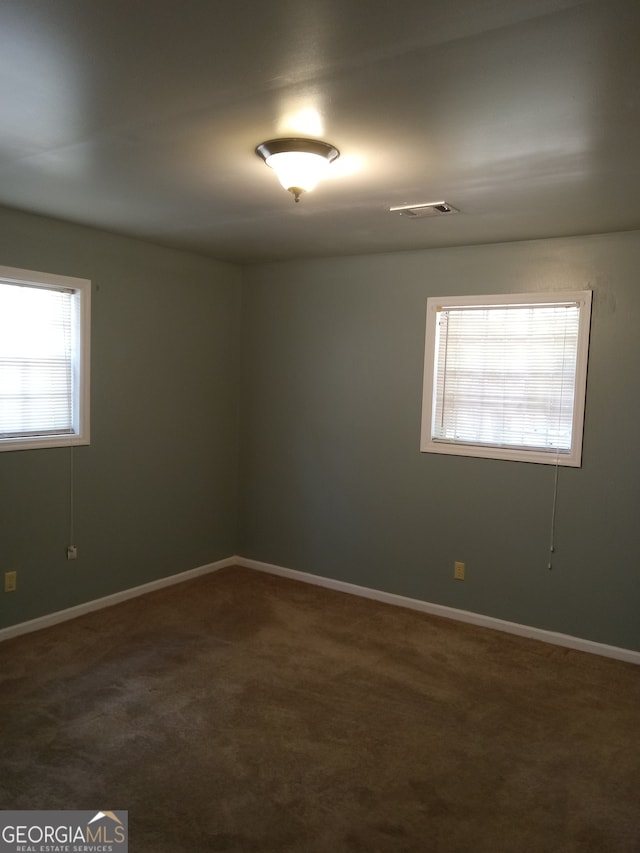 view of carpeted spare room