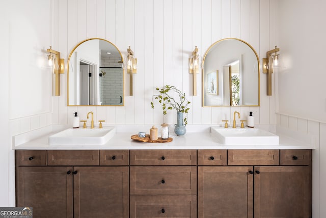 bathroom featuring dual vanity and backsplash