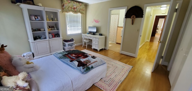 bedroom featuring light wood-type flooring