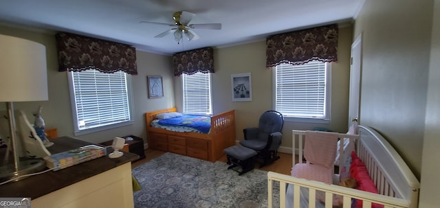 bedroom featuring ceiling fan and hardwood / wood-style floors