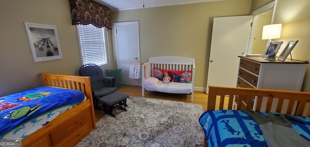 bedroom with wood-type flooring