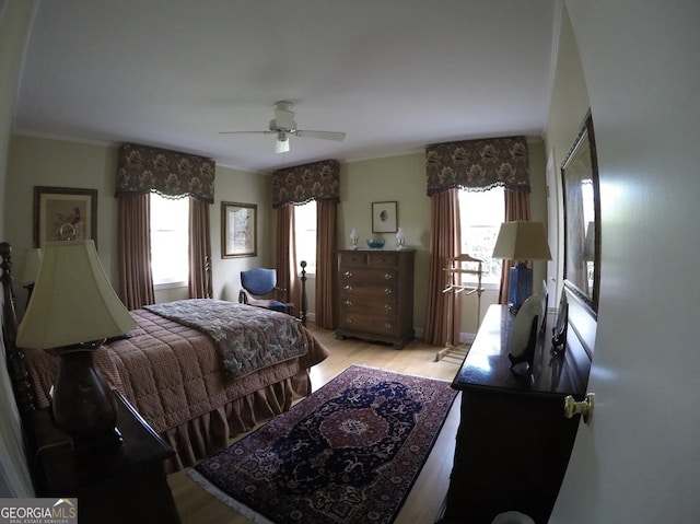 bedroom featuring ceiling fan and light hardwood / wood-style floors