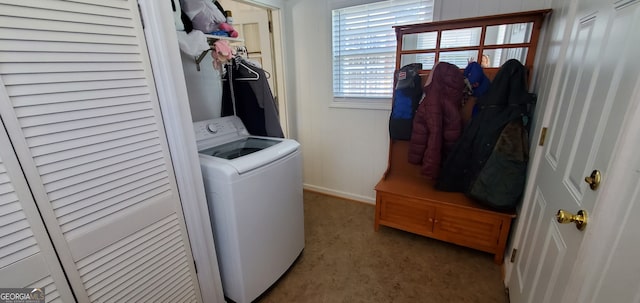 laundry room with carpet and washer / dryer