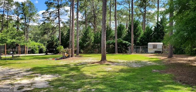 view of yard with a trampoline