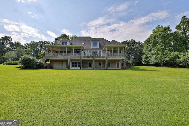 view of front of property featuring a front lawn and a garage