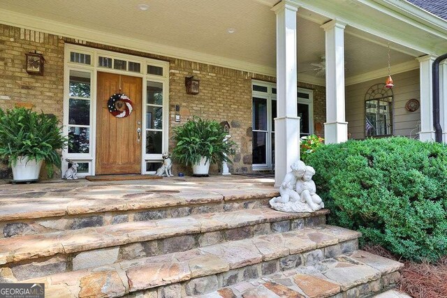 property entrance featuring covered porch