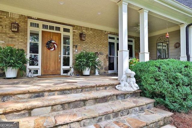 view of exterior entry with covered porch