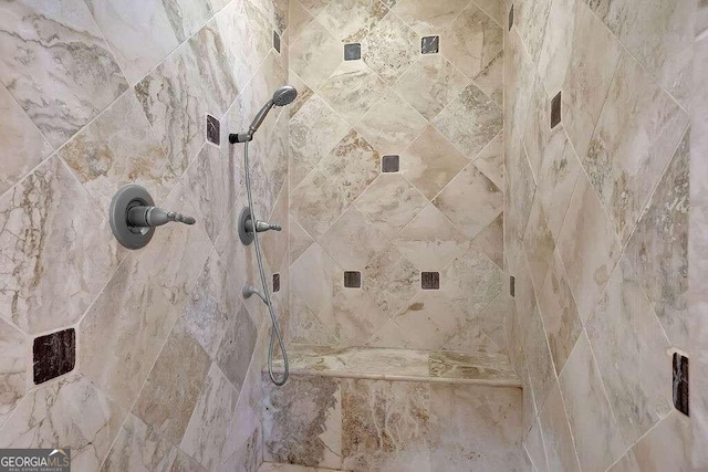 room details with a tile shower