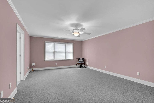 spare room with ornamental molding, a ceiling fan, carpet, and baseboards