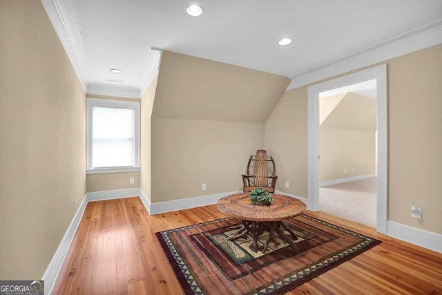 unfurnished room with crown molding, wood finished floors, baseboards, recessed lighting, and vaulted ceiling