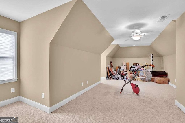 game room featuring ceiling fan, carpet floors, and vaulted ceiling