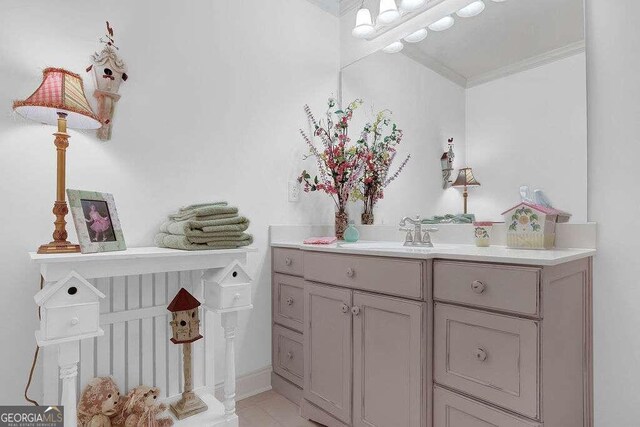 bathroom featuring crown molding and vanity