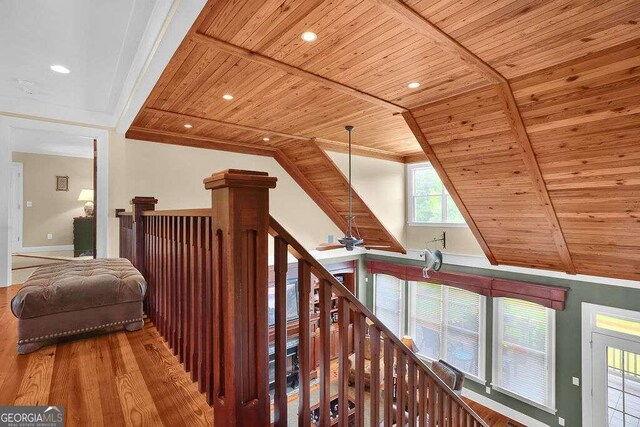 hallway with wooden ceiling, vaulted ceiling, and wood-type flooring