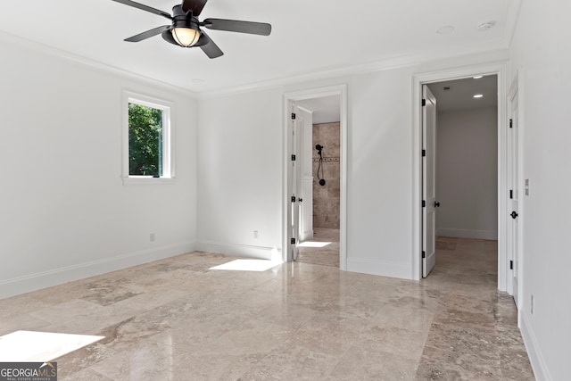 empty room featuring ornamental molding and ceiling fan