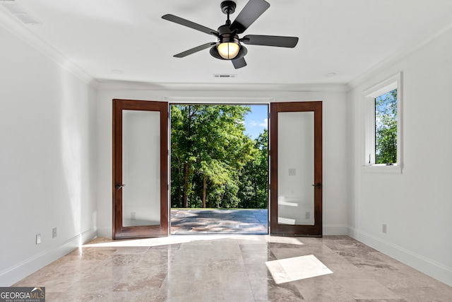 interior space featuring ceiling fan, french doors, and ornamental molding