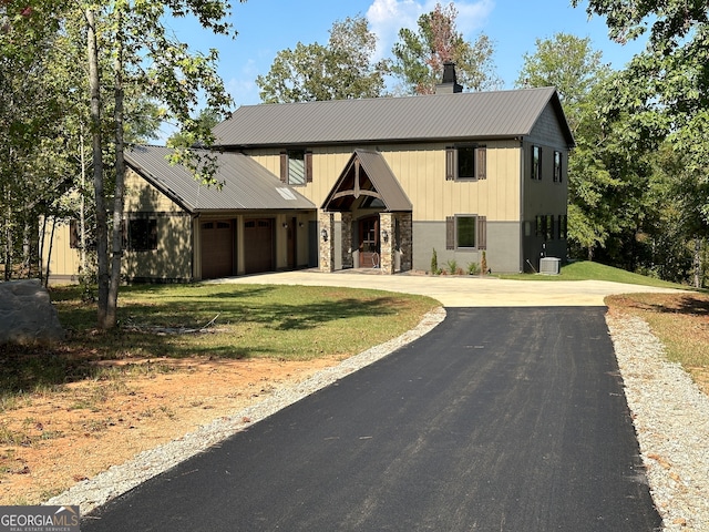 view of front facade featuring a garage and a front lawn