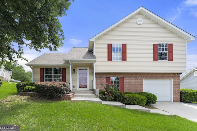 tri-level home with a garage and a front lawn