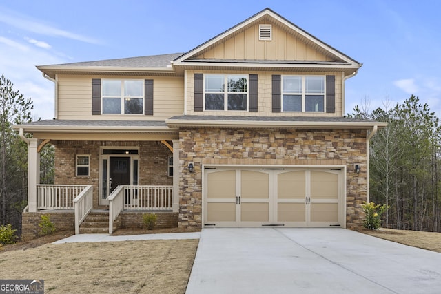 craftsman house featuring a porch and a garage