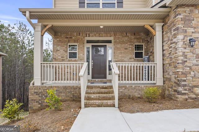 property entrance featuring covered porch