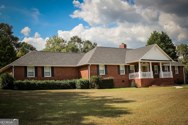 ranch-style house with a front lawn and covered porch