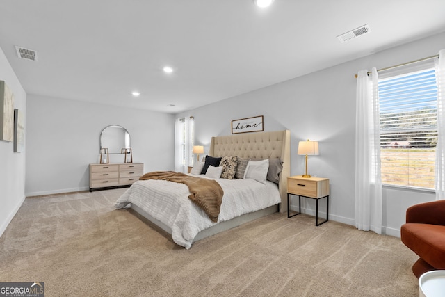 bedroom with light colored carpet