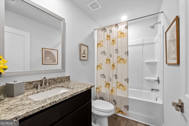 full bathroom with vanity, toilet, wood-type flooring, and shower / tub combo with curtain