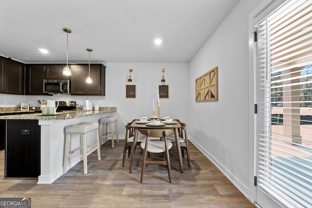 dining room with light wood-type flooring