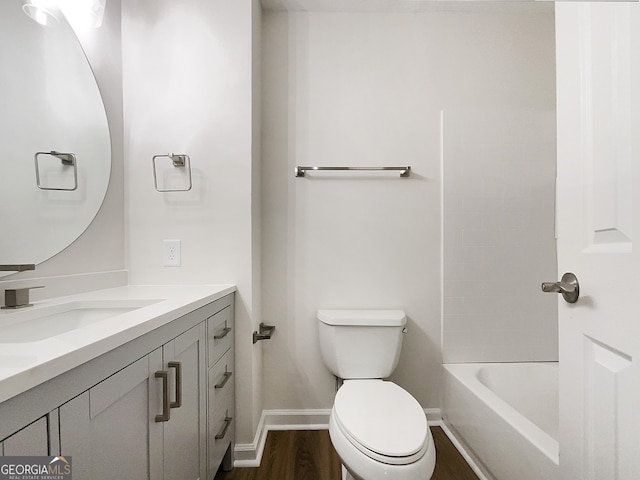 bathroom featuring vanity, toilet, and wood-type flooring