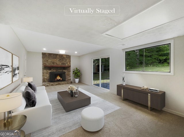 carpeted living room featuring a fireplace