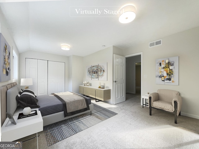 bedroom featuring lofted ceiling, carpet floors, and a closet