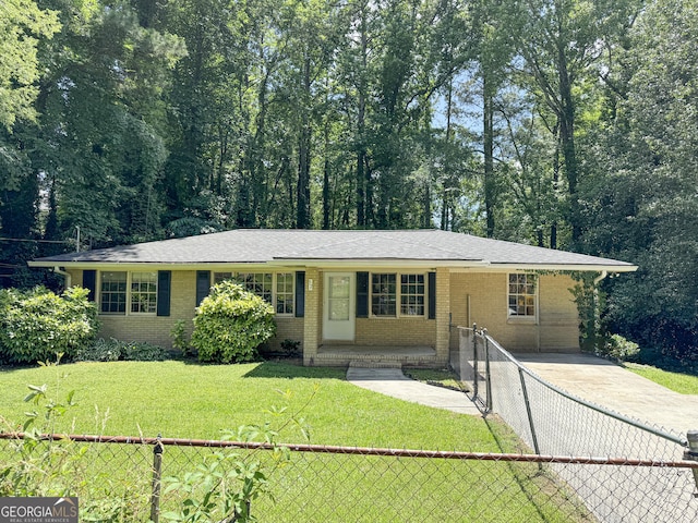 ranch-style home with a front lawn