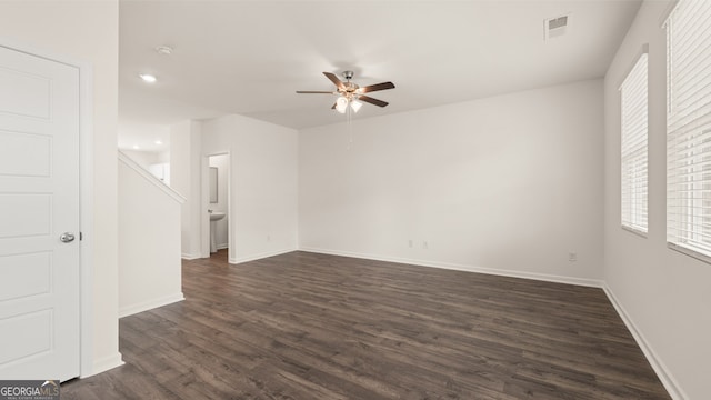 interior space with dark hardwood / wood-style flooring and ceiling fan