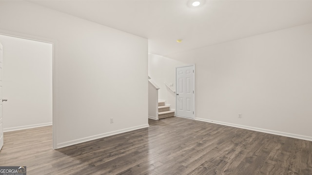 unfurnished room featuring dark hardwood / wood-style flooring