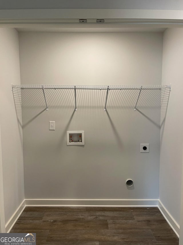 washroom with electric dryer hookup, washer hookup, and dark hardwood / wood-style floors