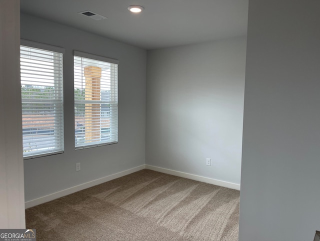 unfurnished room featuring carpet flooring