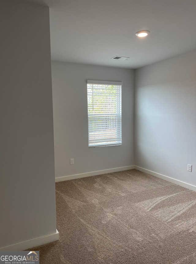 empty room featuring carpet floors