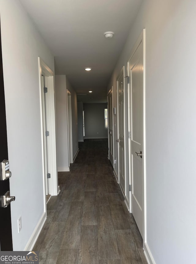 hallway featuring dark hardwood / wood-style floors