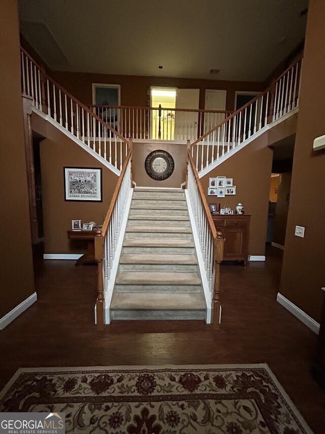 stairway featuring hardwood / wood-style floors