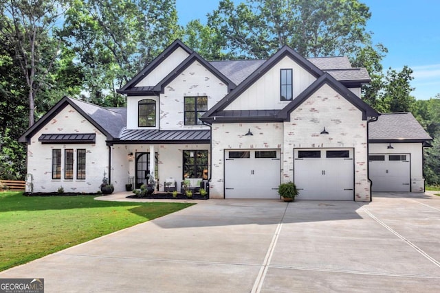 view of front of property with a front yard and a garage